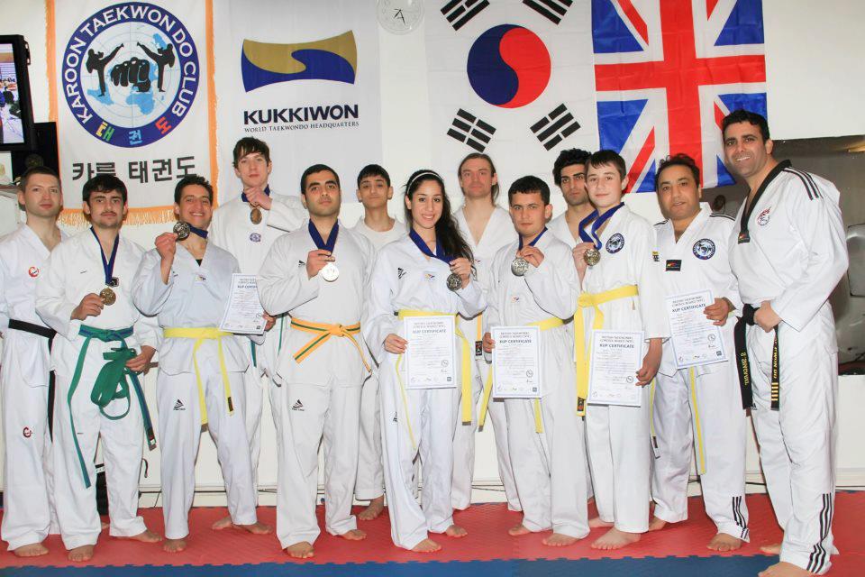 taekwondo classes london Excited Taekwondo students celebrate with their instructor,